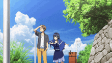 a man and a girl standing next to each other in front of a blue sky