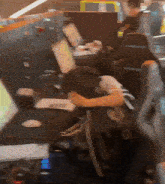 a blurred image of a person sitting in front of a laptop