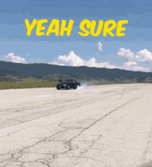 a car is driving down a road with the words yeah sure written above it
