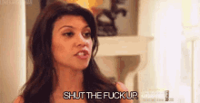 a woman is saying `` shut the fuck up '' in a room .