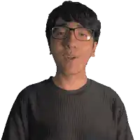 a man wearing glasses and a black shirt that says dedan on it