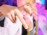 a close up of a person 's finger pointing at the camera