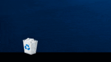 a recycling bin with a blue recycle symbol on it