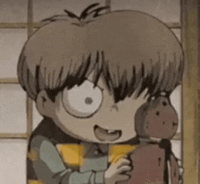 a cartoon character is holding a stuffed animal in his hands .