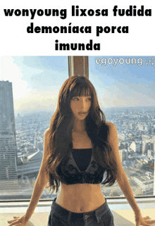 a woman in a crop top stands in front of a window with the words wonyoung lixosa fudida demoniaca porca imunda