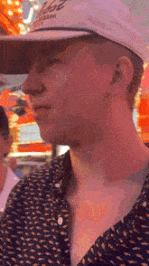 a man wearing a hat that says ' blaze ribbon ' on it