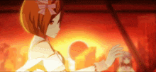 a girl with a bow on her head is dancing in front of a red background
