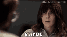 a woman says maybe in front of another woman 's face