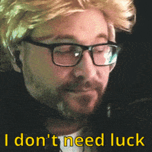 a man wearing glasses and a wig with the words i don 't need luck below him