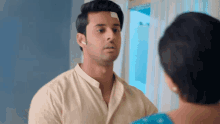 a man in a white shirt has a bandage on his forehead