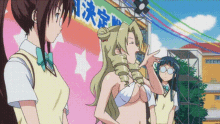 a group of anime girls are standing in front of a sign that says " n "