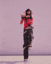 a girl wearing headphones and a red shirt is dancing in a video game