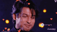 a man is smiling with hearts around his eyes and the twitter account @jazfunloving is visible