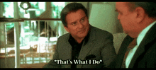 a man in a suit says " that 's what i do " while talking to another man