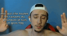 a man wearing a white hat and ear buds says moi qui cite toutes