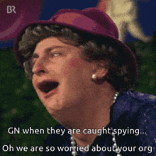 a man wearing a purple hat and pearls is saying " gn when they are caught spying "