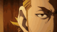 a close up of a man 's face with a yellow hair
