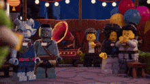 a group of lego figures with one wearing a name tag that says ' amanda ' on it