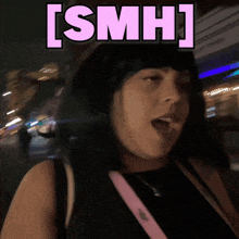 a woman with black hair and a pink sticker that says [ smh ]