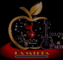 a gold apple with a red apple inside of it and a guitar on a black background .