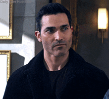 a close up of a man 's face with the words daily alter hoechlin in the background