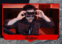 a man wearing goggles with benzer on the bottom right