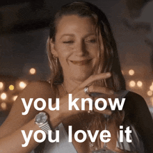 a woman holding a glass of wine with the words " you know you love it " above her