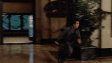 a blurry picture of a man running in a room