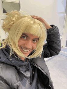 a man wearing a wig and a black jacket