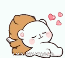 a brown teddy bear is hugging a white teddy bear .