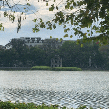a large body of water surrounded by trees and buildings