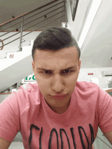 a man wearing a pink shirt that says florida