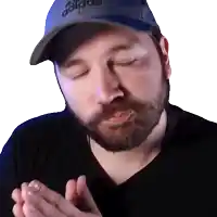 a man with a beard wearing a hat that says adidas