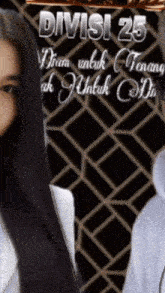 a woman with long black hair stands in front of a sign that says " divisi 25 "