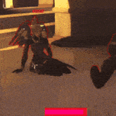 a video game character with wings is kneeling down on the floor .