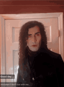 a picture of a vampire with red eyes and a good day message