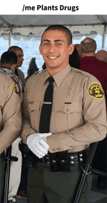 a police officer stands in front of a crowd with the caption / me plants drugs above him