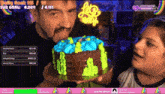 a man and a woman holding a cake with the words let 's party on it