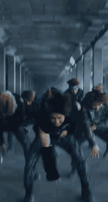a blurry picture of a person in a black top and pants