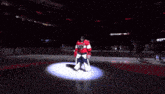 a hockey player stands on the ice in front of a avis sign