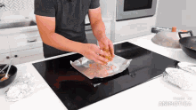 a man is cooking on a stove with the words made in animatica visible