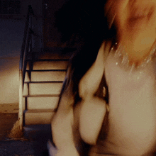 a blurry image of a person walking down stairs
