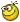 a pixel art of a yellow smiley face with glasses and a bow on its head .