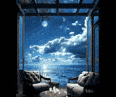 a balcony overlooking the ocean at night
