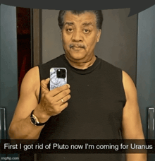 a man taking a selfie with the caption first i got rid of pluto now i 'm coming
