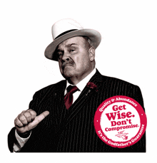 a man in a suit has a button that says get wise don t compromise