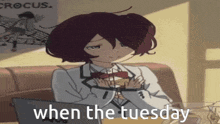 a girl is sitting at a table with a laptop and the words " when the tuesday " written on the bottom