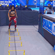 bayley jumping hurdles obstacle course wwe smack down