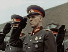 a man in a military uniform has a medal on his chest that says ' u.s. army '