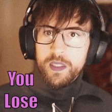 a man wearing glasses and headphones says you lose